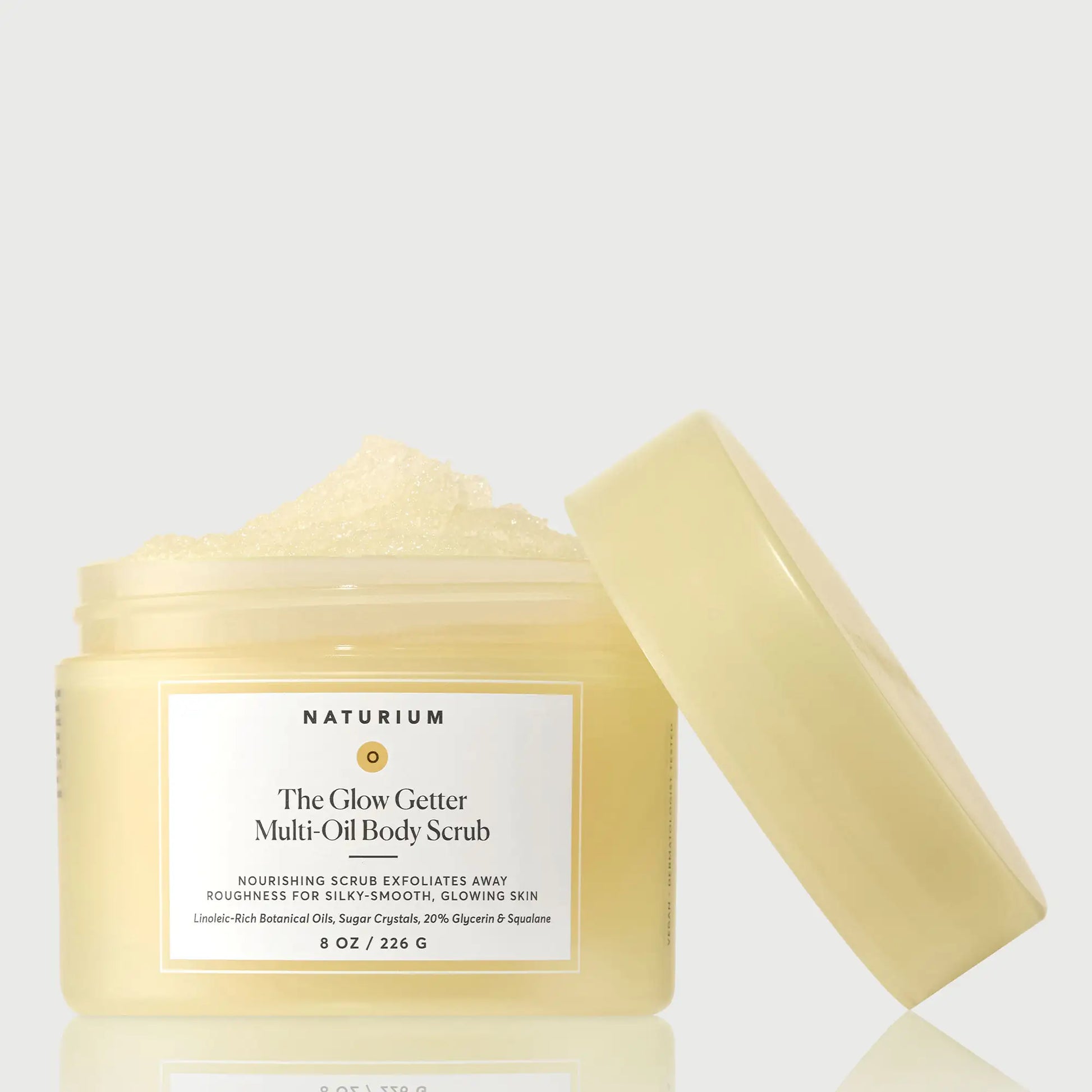 the-glow-getter-multi-oil-body-scrub-o0 NATR-40028-GlowGetter-Multi-Oil-Body-Scrub-Front-CapOff-bonebkgd.webp